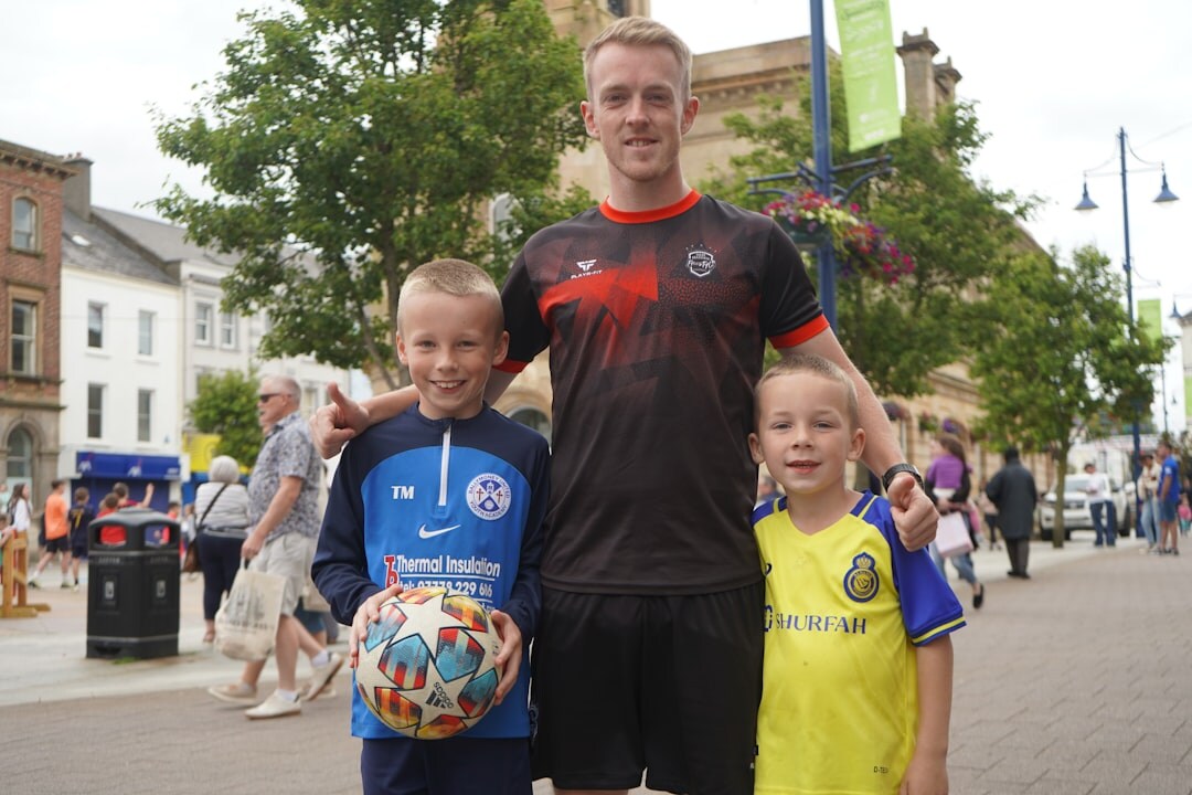 local sports champion posing with medal